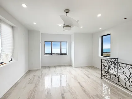 a view of an empty room and glass door