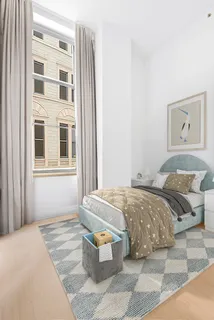 a bedroom with bed and window