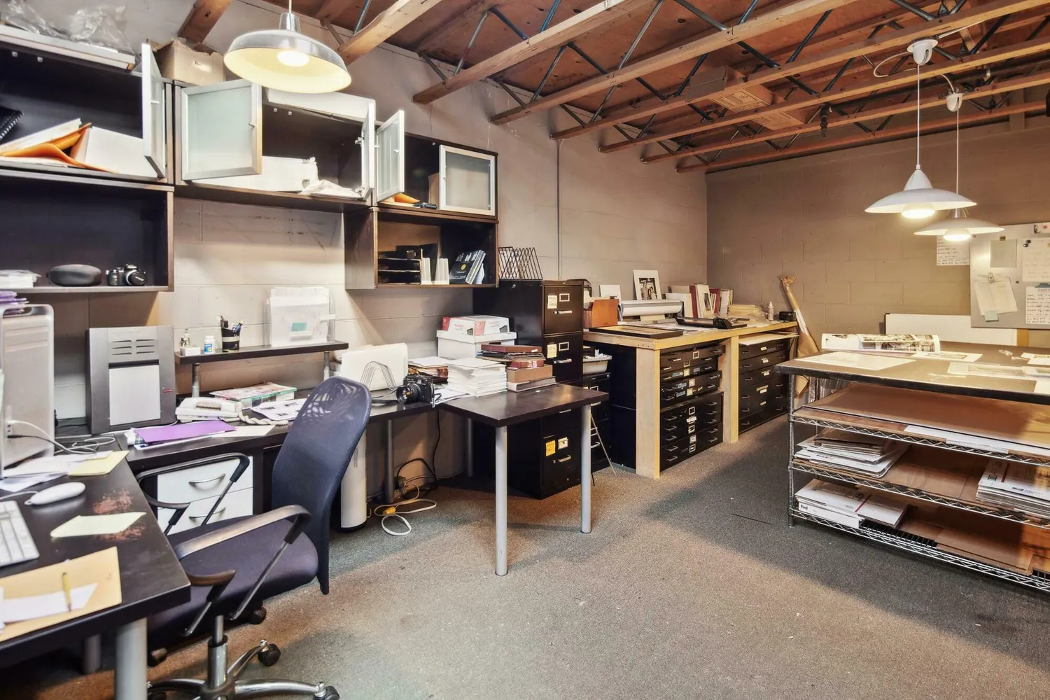 a room with gym equipment and a view of store