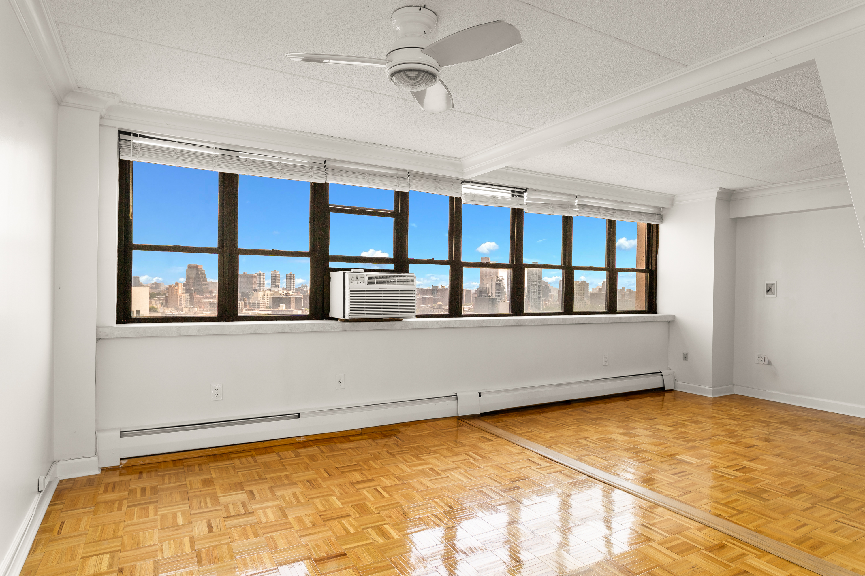 300 West 110th Street, Unit 16A Manhattan, NY 10025 - Photo 5 of 13 a view of an empty room with a window