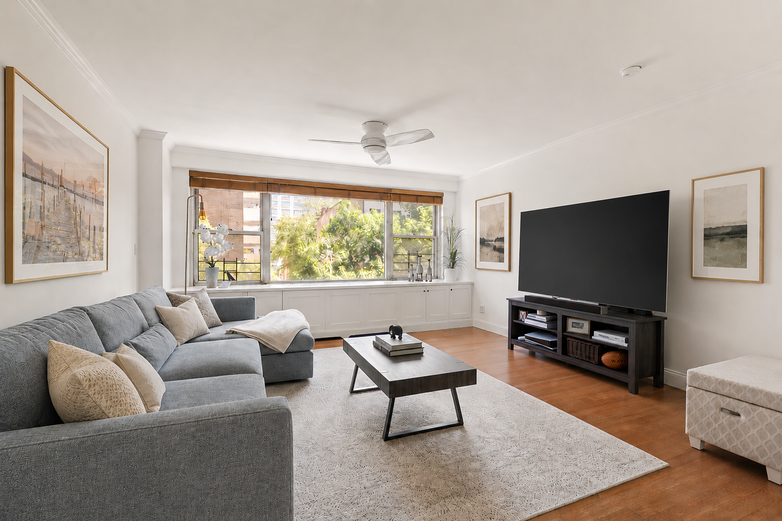a living room with furniture and a flat screen tv