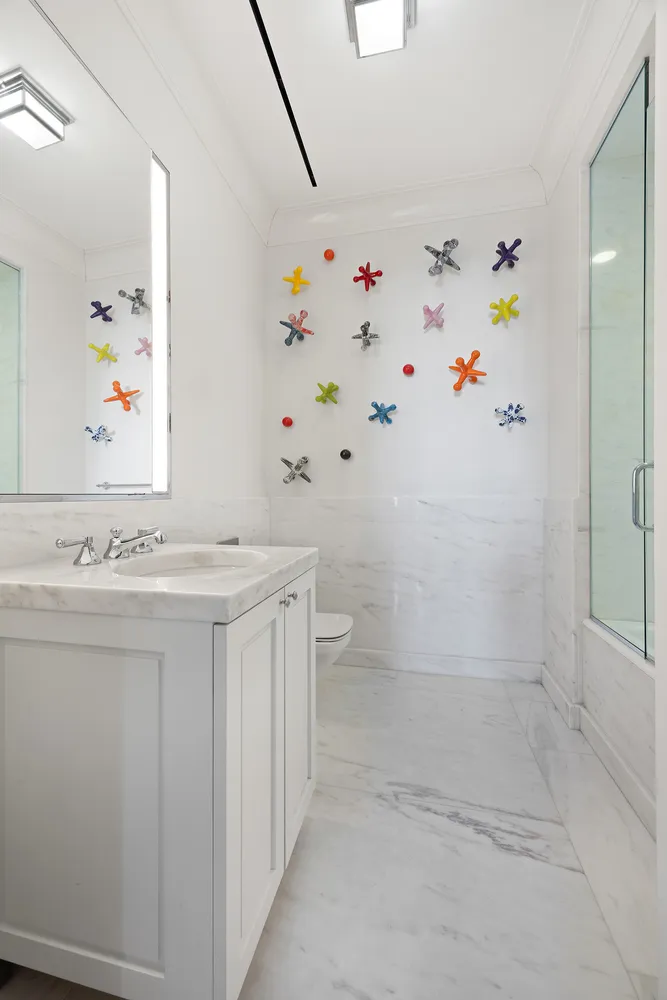 a bathroom with a shower sink and mirror