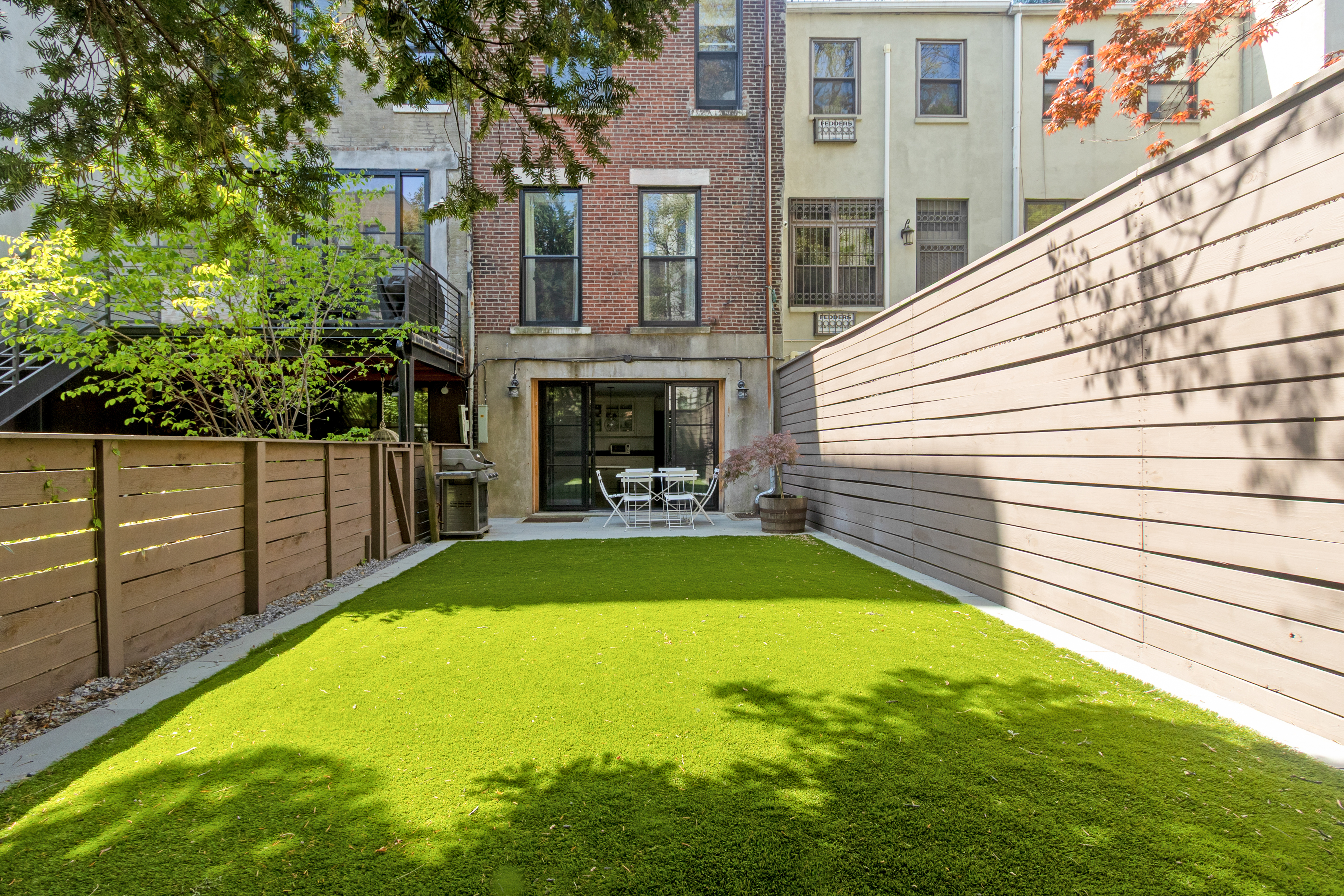 125 West 132nd Street Manhattan, NY 10027 - Photo 4 of 21 a view of a backyard with sitting area