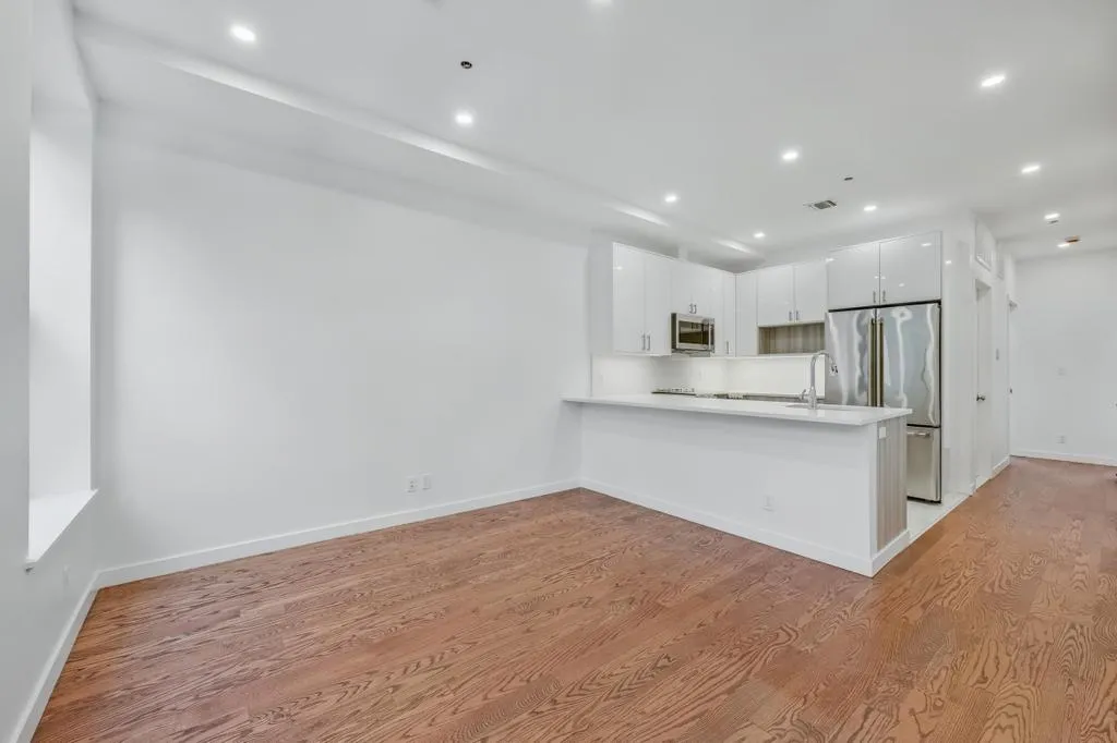 a view of kitchen with wooden floor