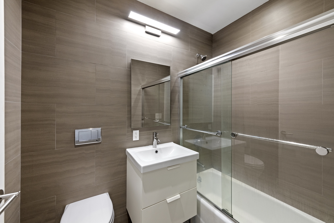 220 West 79th Street, Unit PARLOUR Manhattan, NY 10024 - Photo 4 of 9 a bathroom with a sink a toilet and shower