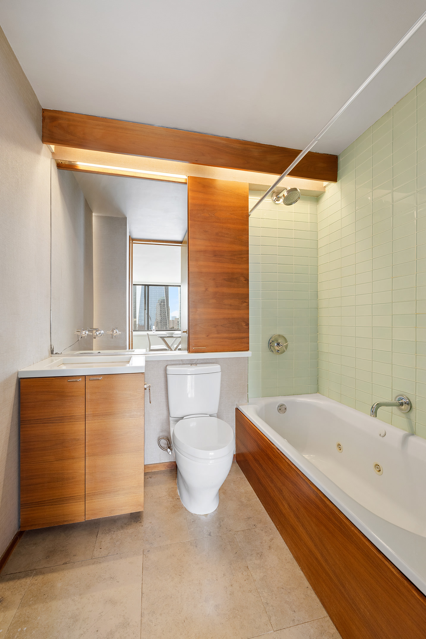 200 Rector Place, Unit 36LM Manhattan, NY 10280 - Photo 11 of 15 a bathroom with a tub a sink and a large mirror