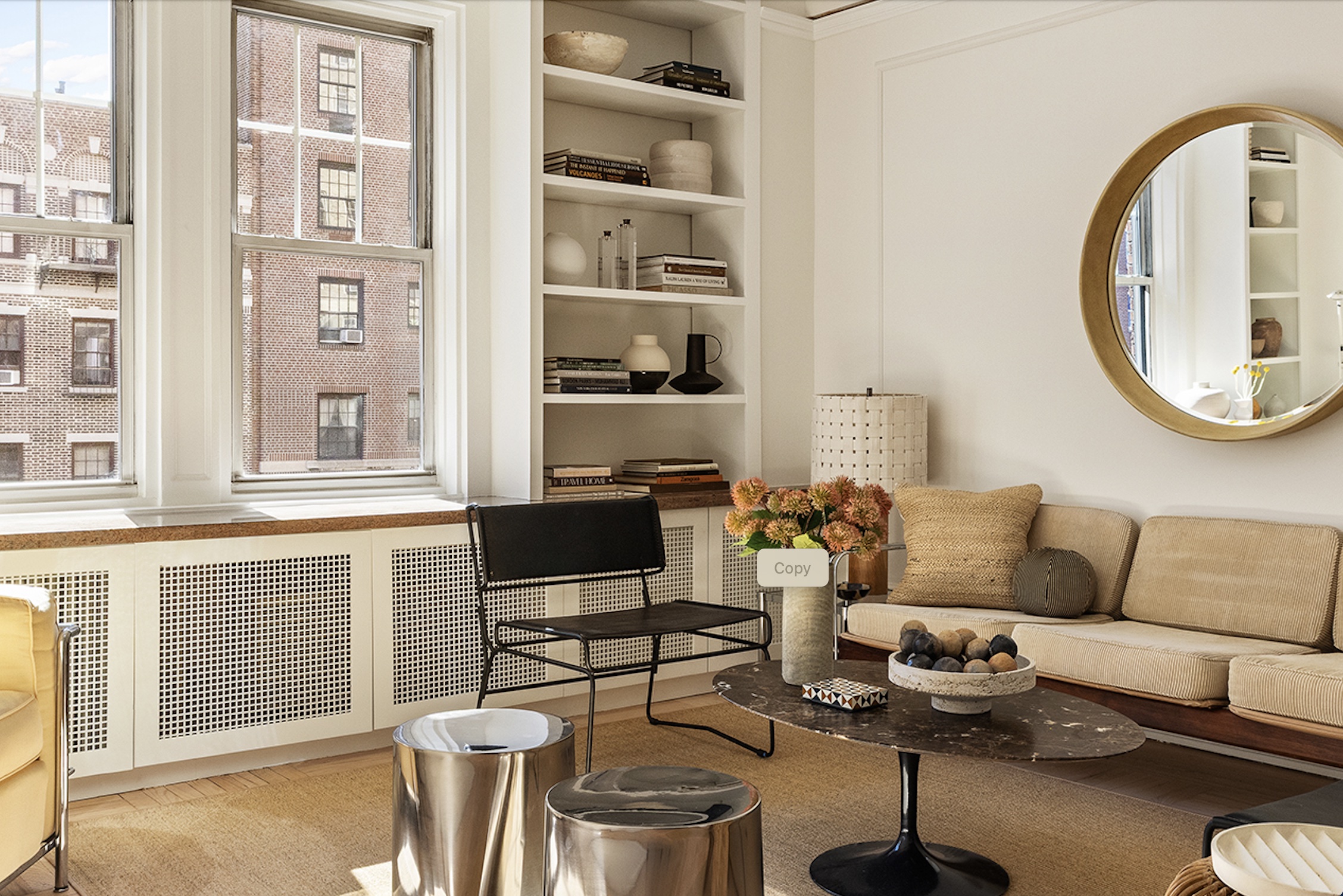 30 5th Avenue, Unit 6H Manhattan, NY 10011 - Photo 5 of 17 a living room with furniture and a floor to ceiling window