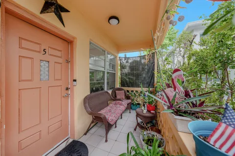 a view of an outdoor sitting area with furniture