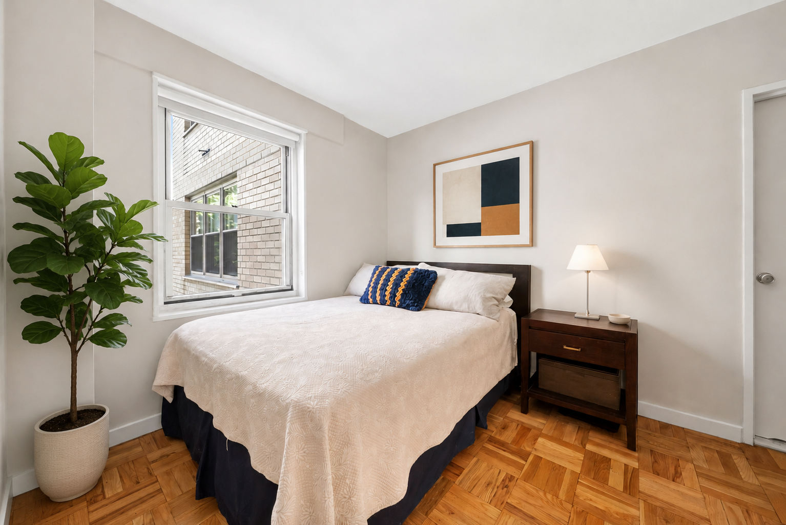 20 East 9th Street, Unit 4T Manhattan, NY 10003 - Photo 4 of 6 a bedroom with a bed and a potted plant