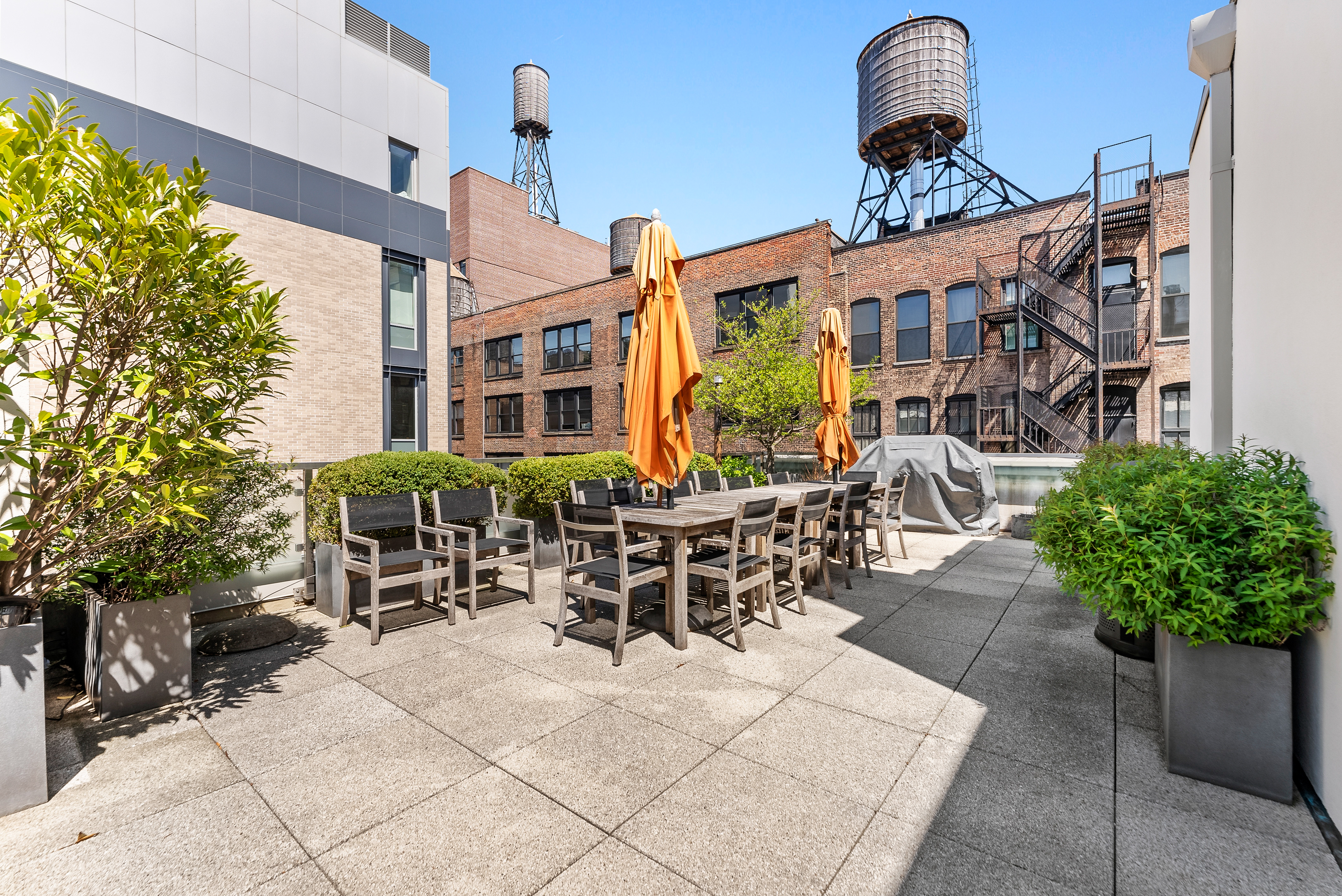 15 West 20th Street, Unit 9A Manhattan, NY 10011 - Photo 19 of 21 a view of a patio with table and chairs and potted plants