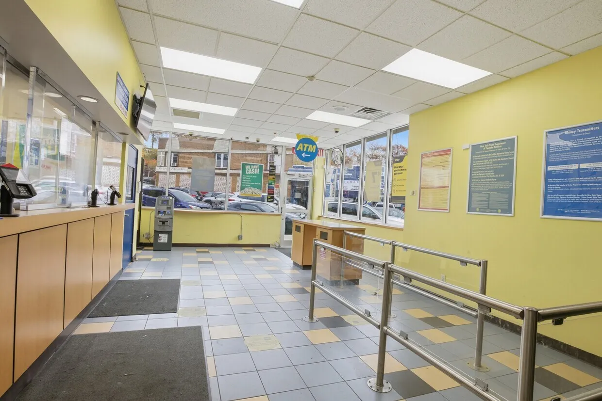 a view of a kitchen with kitchen island stainless steel appliances cabinets and a counter top space