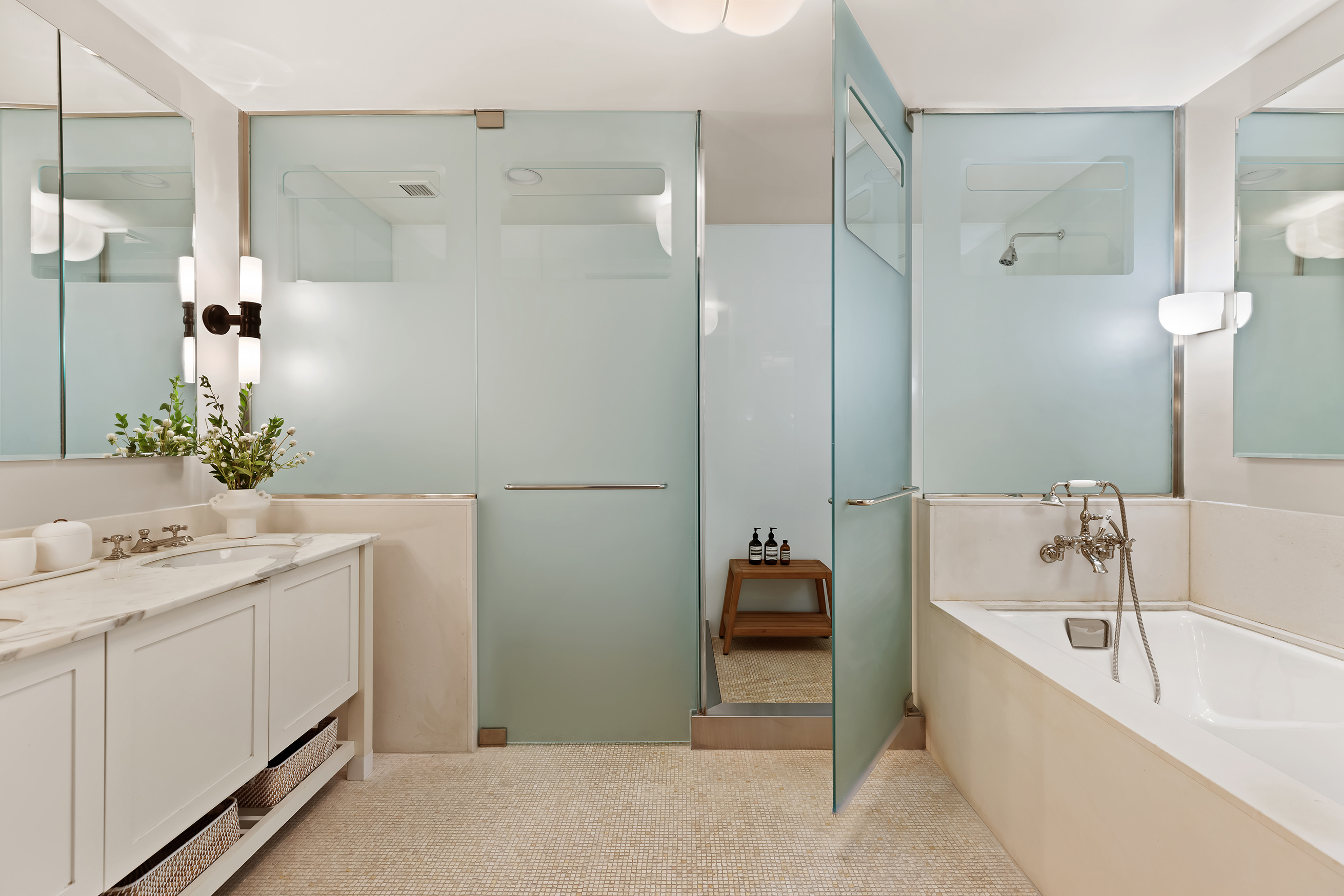 92 Laight Street, Unit 5E Manhattan, NY 10013 - Photo 20 of 26 a bathroom with a tub sink and mirror