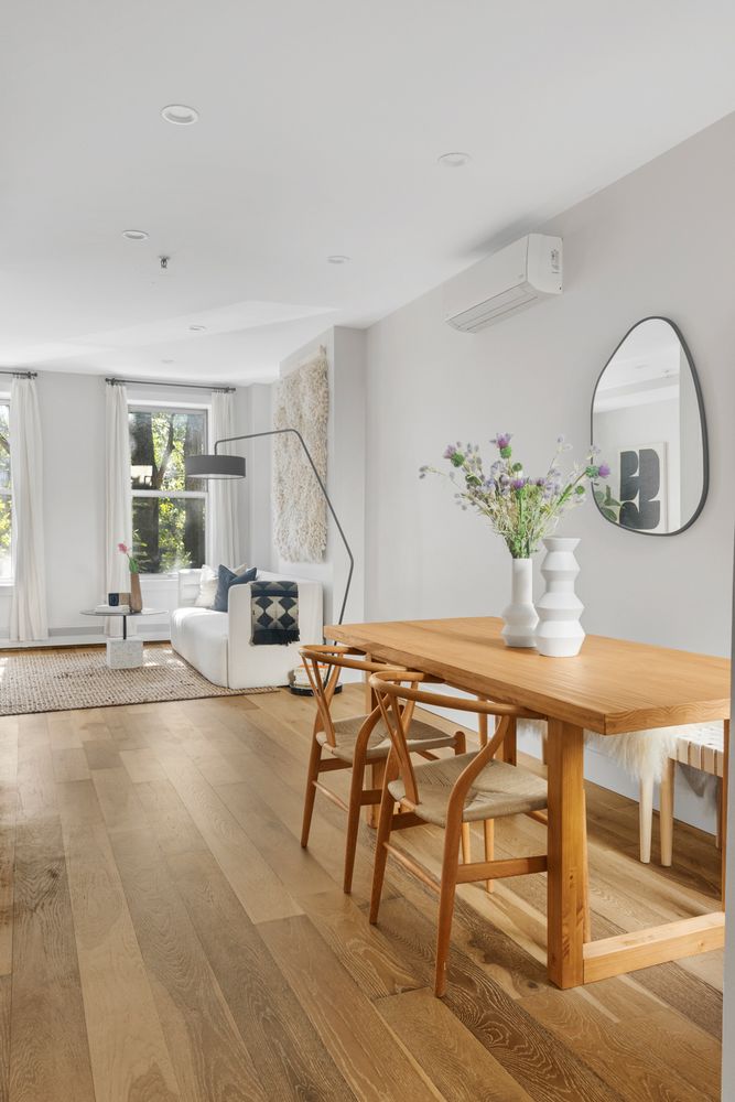 249 Hull Street, Unit C Brooklyn, NY 11233 - Photo 5 of 14 a view of a livingroom with furniture and wooden floor