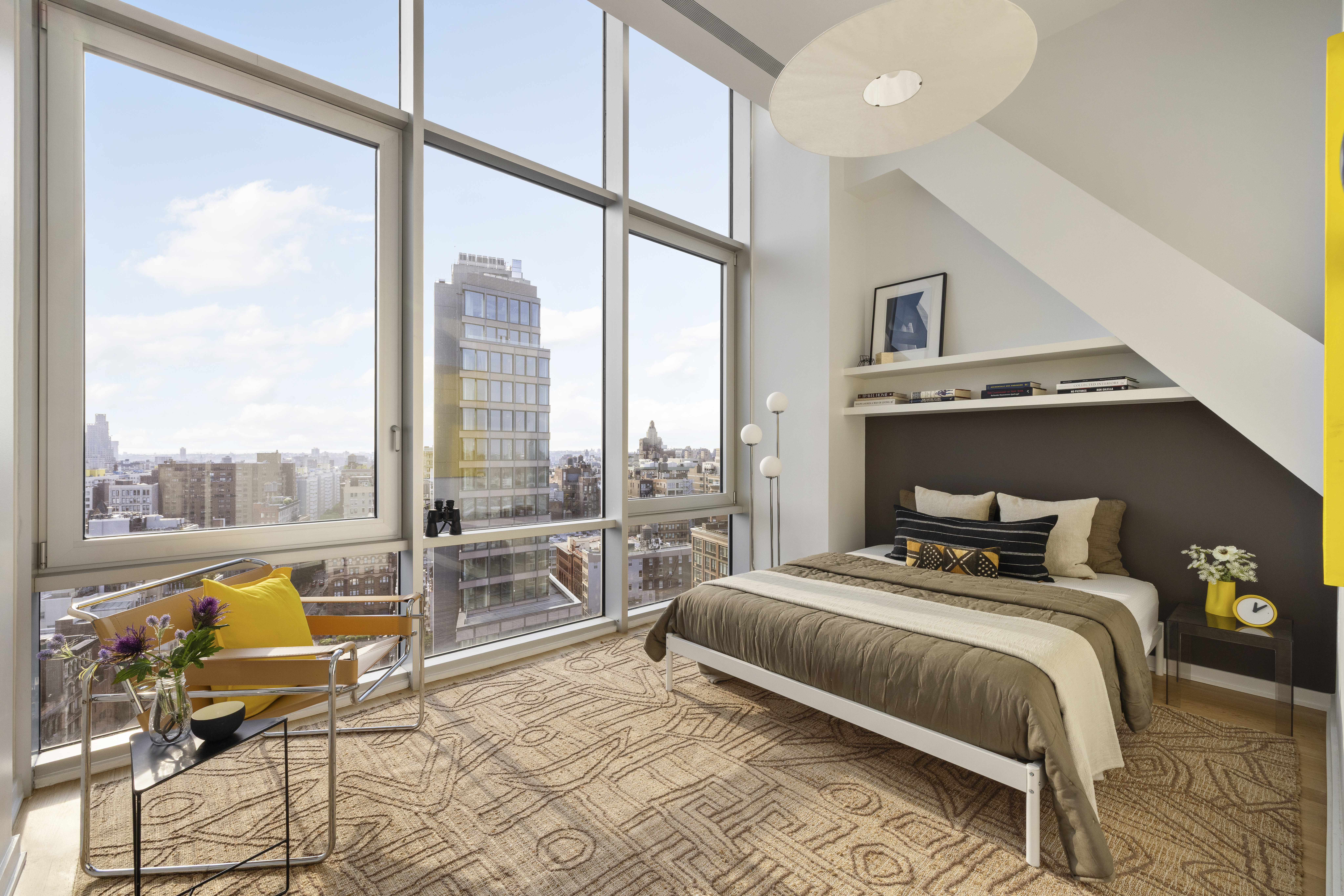 52 East 4th Street, Unit PH3 Manhattan, NY 10003 - Photo 14 of 22 a bedroom with a bed and a large window with outer view
