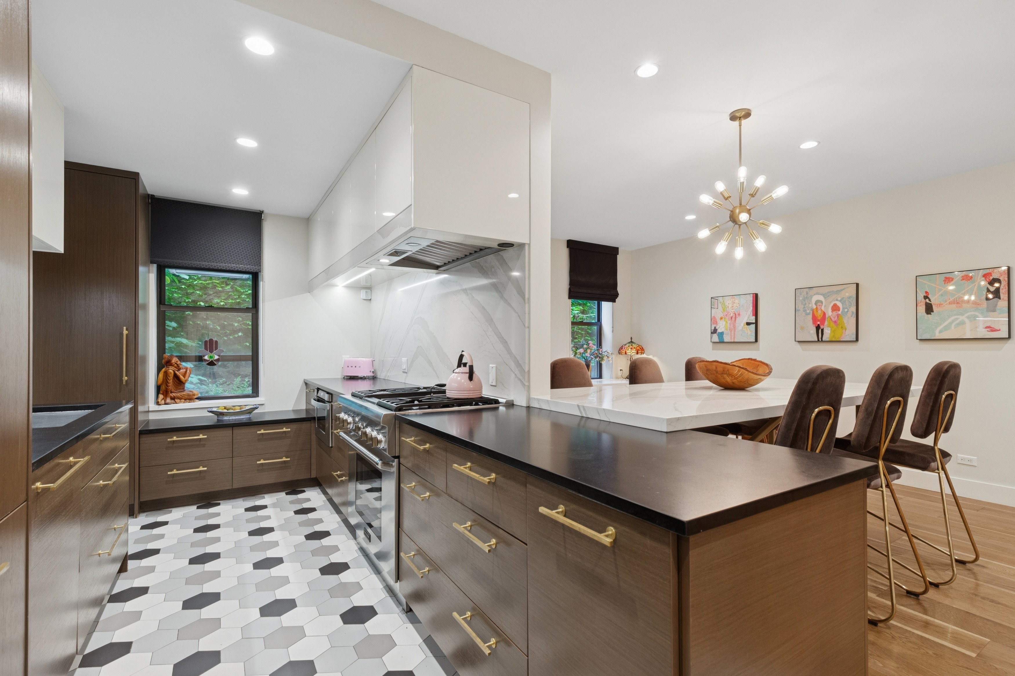 125 Cabrini Boulevard, Unit A22 Manhattan, NY 10033 - Photo 3 of 20 a kitchen with a sink a stove a table and chairs