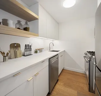 a kitchen with a sink and a refrigerator