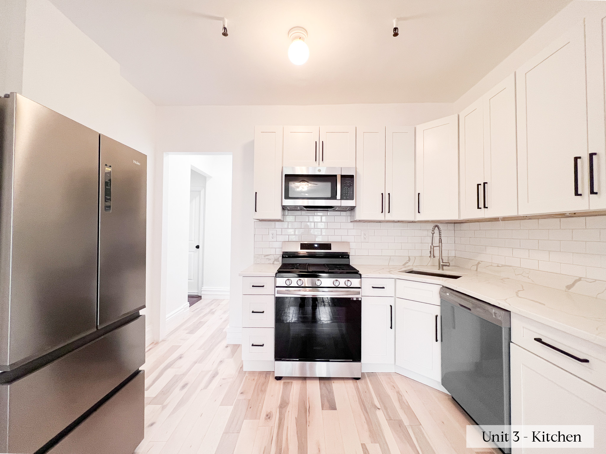 460 9th Street Brooklyn, NY 11215 - Photo 16 of 24 a kitchen with white cabinets stainless steel appliances and a counter space
