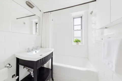 a bathroom with a sink and a bathtub