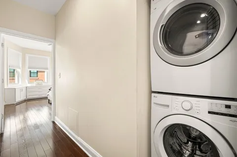 a view of a hallway with washer and dryer