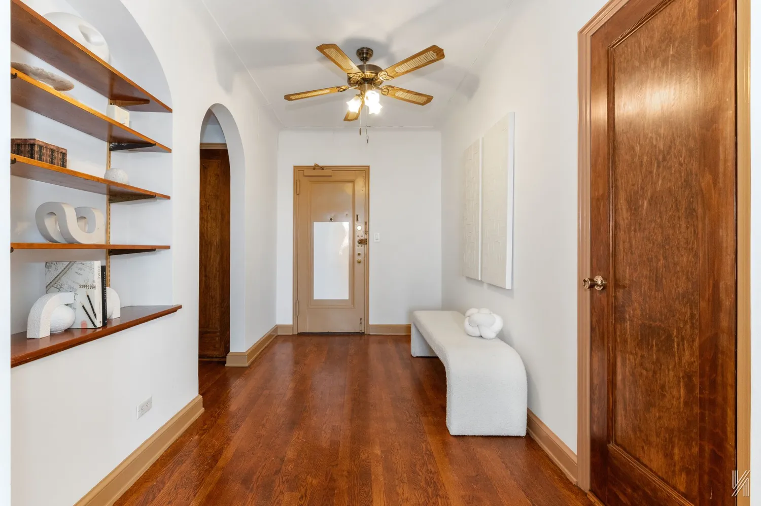 a view of an entryway with wooden floor