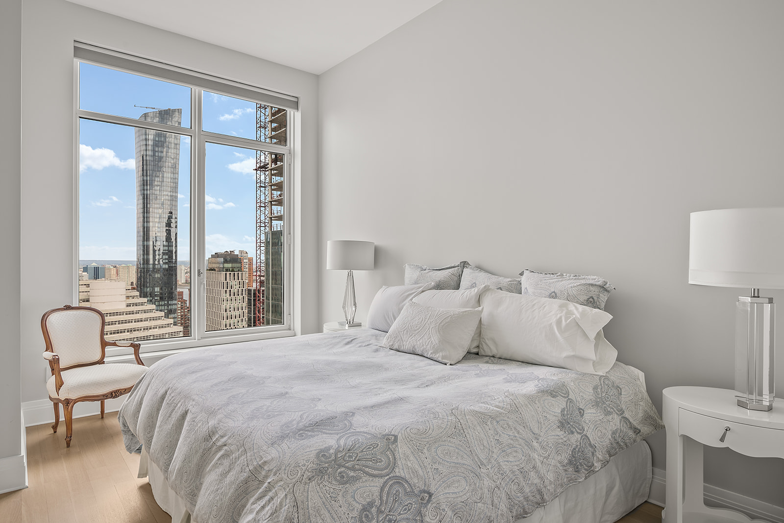 30 Park Place, Unit 43A Manhattan, NY 10007 - Photo 8 of 13 a bedroom with a large bed and a large window