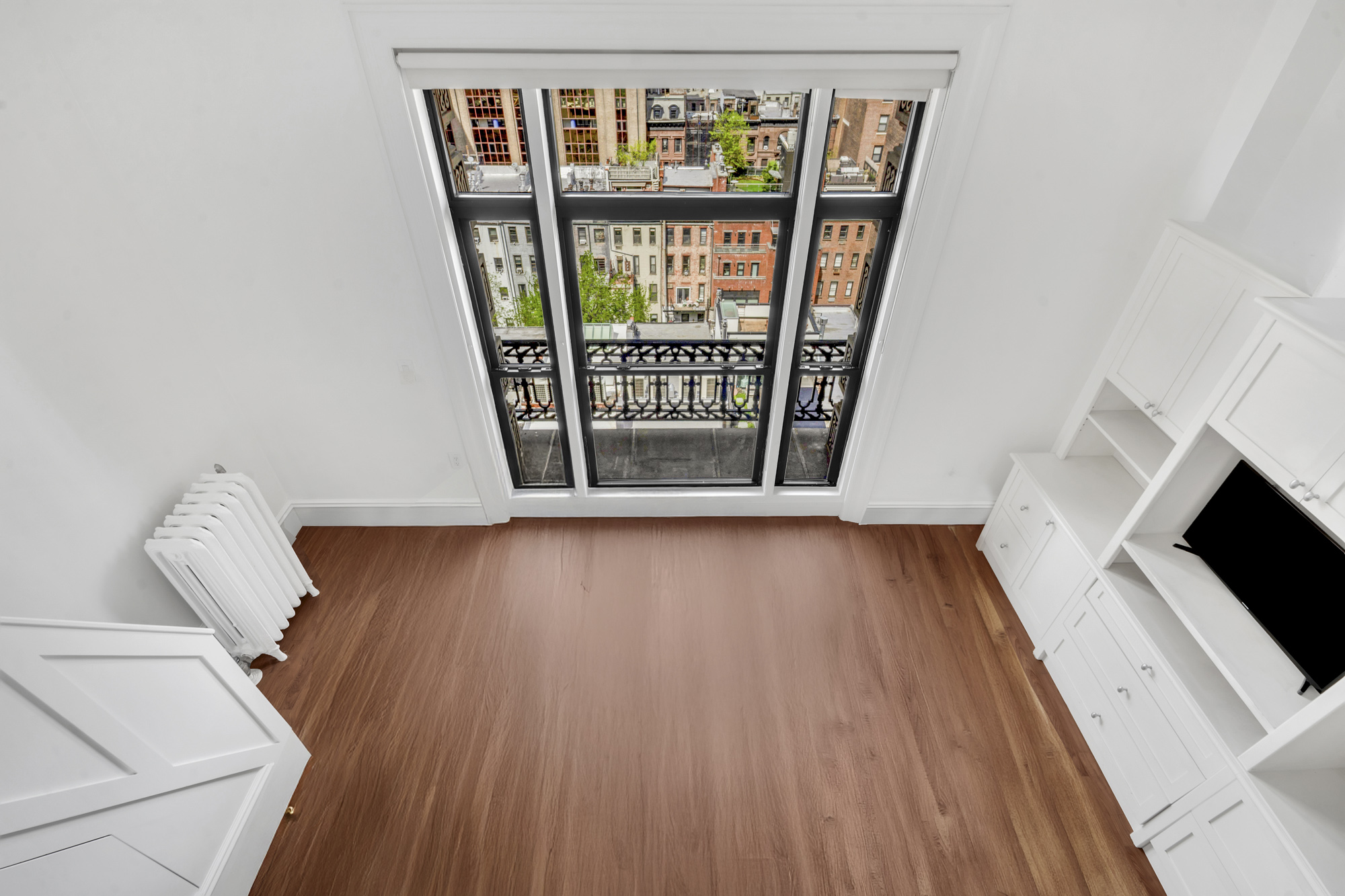140 West 69th Street, Unit 107A Manhattan, NY 10023 - Photo 6 of 15 a view of an entryway with wooden floor