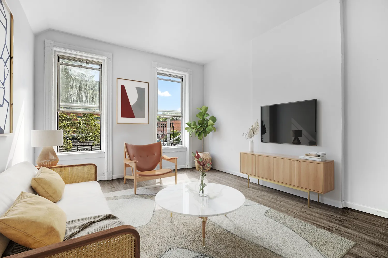 a living room with furniture and a flat screen tv