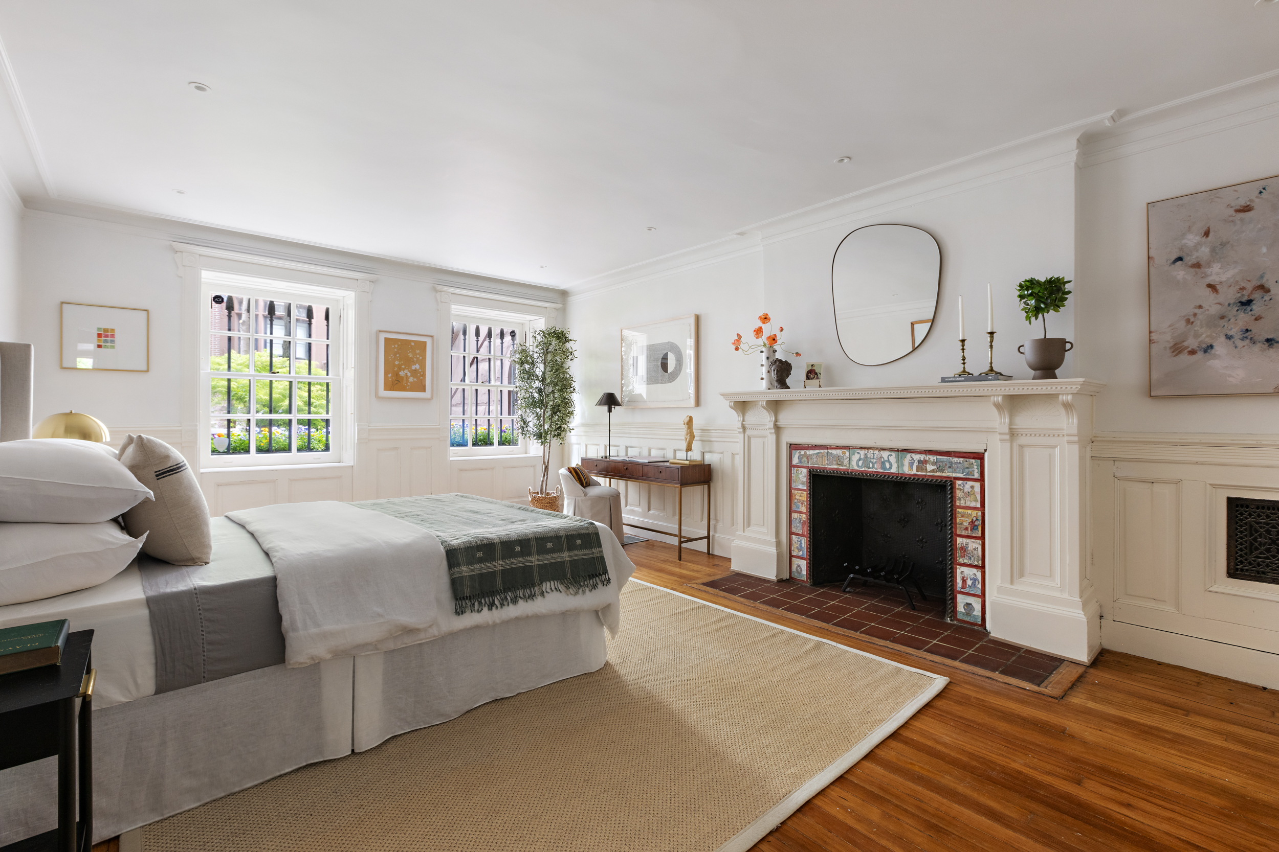 37 West 70th Street Manhattan, NY 10023 - Photo 18 of 41 a bedroom with a bed and wooden floor