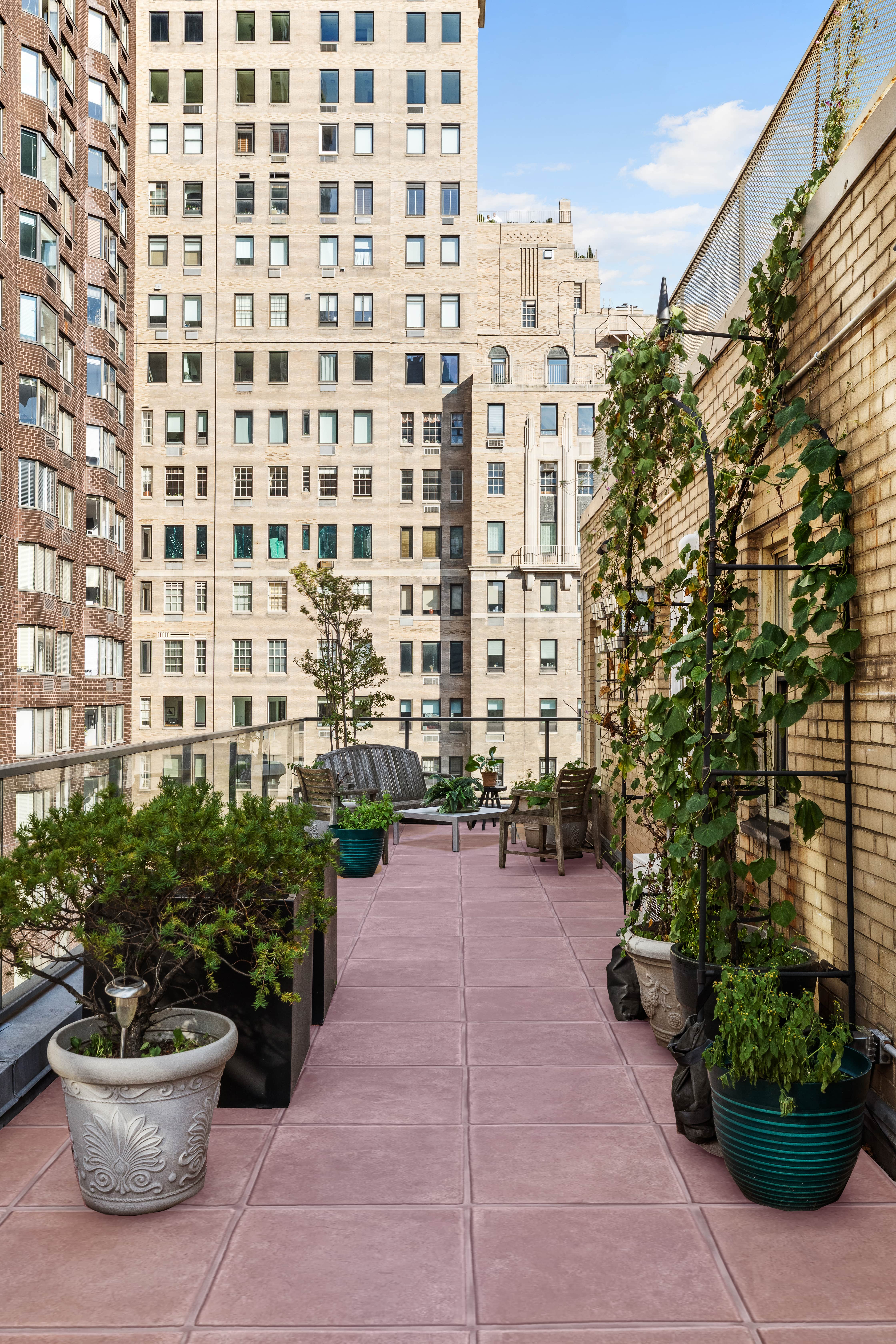 415 East 52nd Street, Unit 12CB Manhattan, NY 10022 - Photo 5 of 12 a view of a patio with plants and chairs