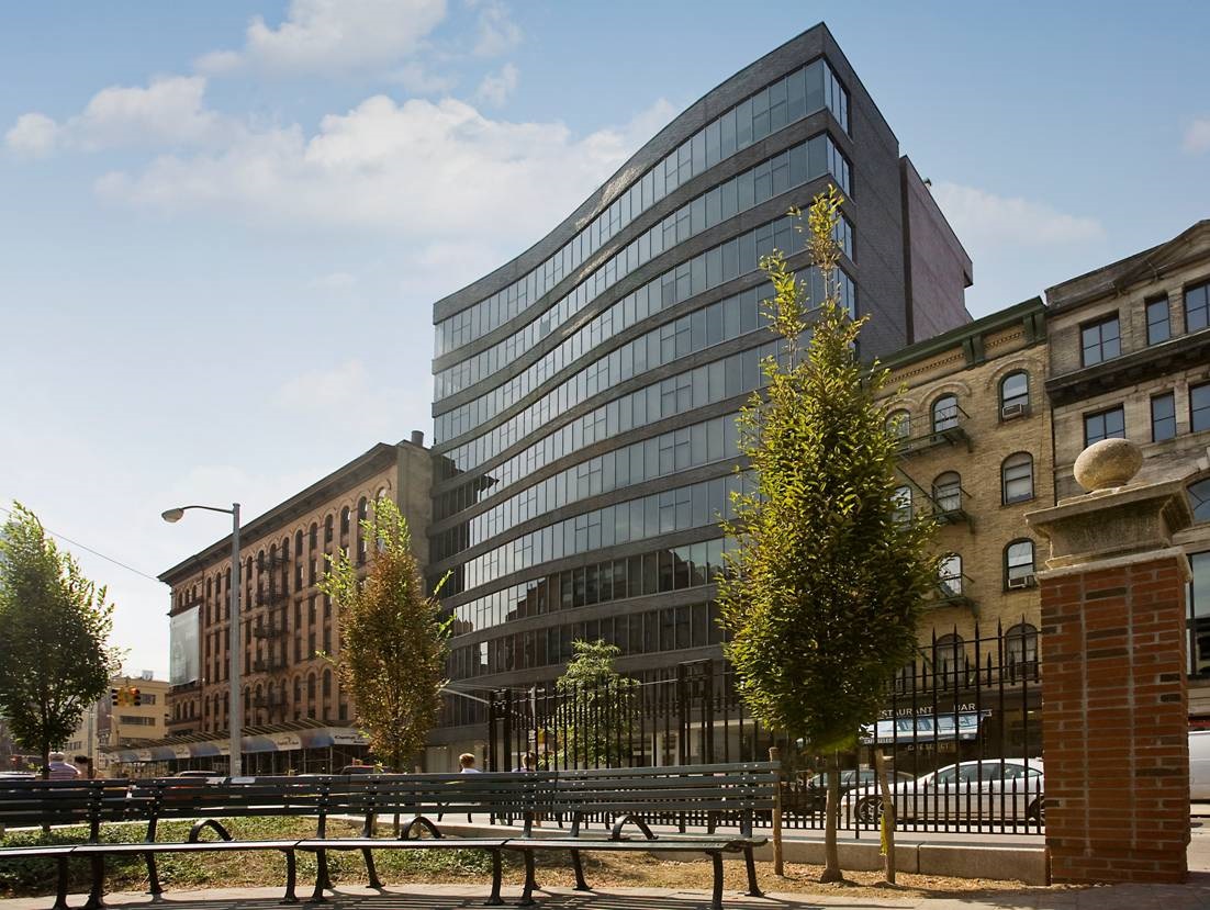 210 Lafayette Street, Unit 2E Manhattan, NY 10012 - Photo 10 of 11 a front view of a building with glass windows