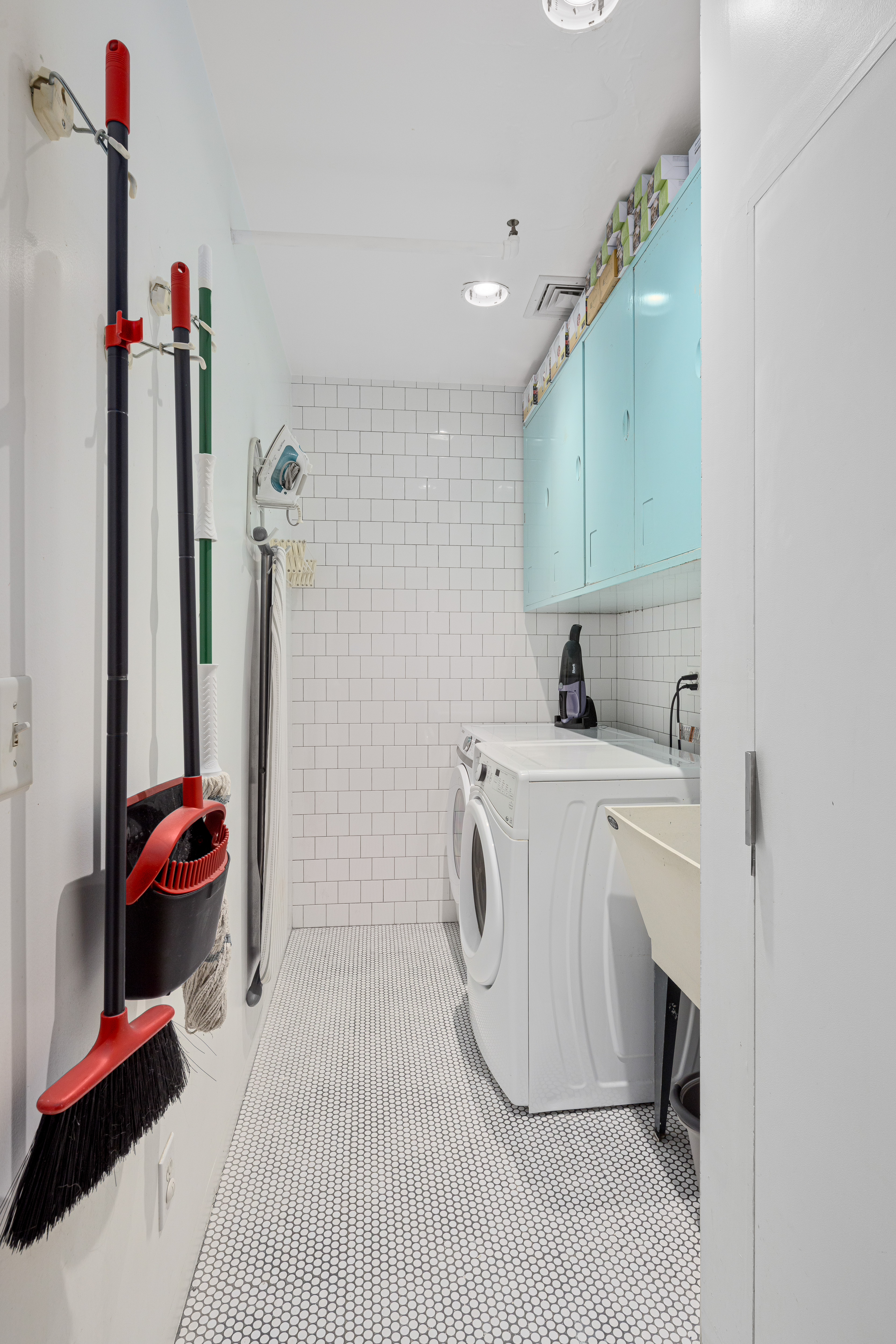191 Chrystie Street, Unit 5R Manhattan, NY 10002 - Photo 13 of 16 a utility room with dryer and washer
