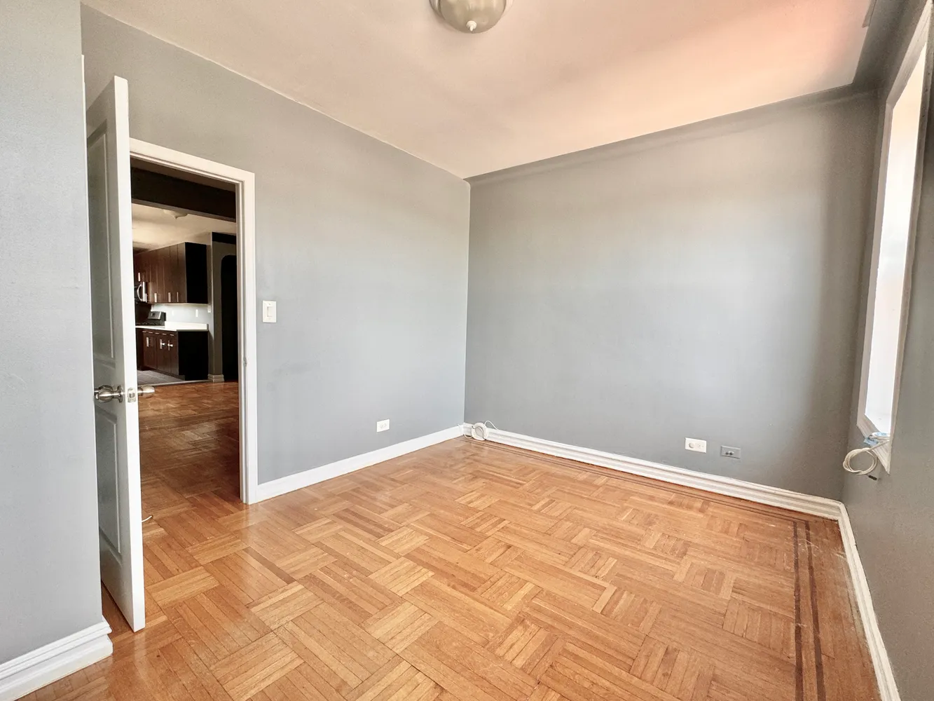 a view of an empty room and window