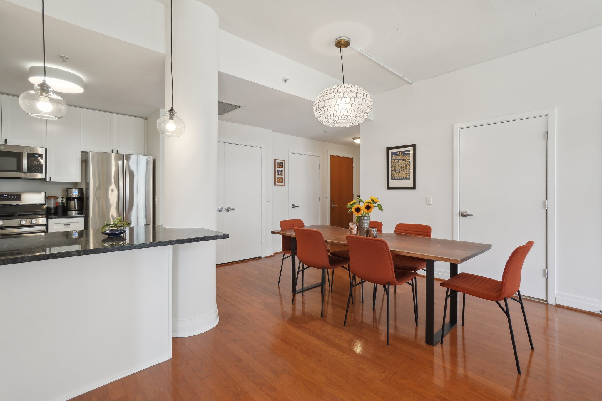 2120 Vermont Avenue Northwest, Unit 309 Washington, DC 20001 - Photo 5 of 26 a view of a dining room with furniture and wooden floor
