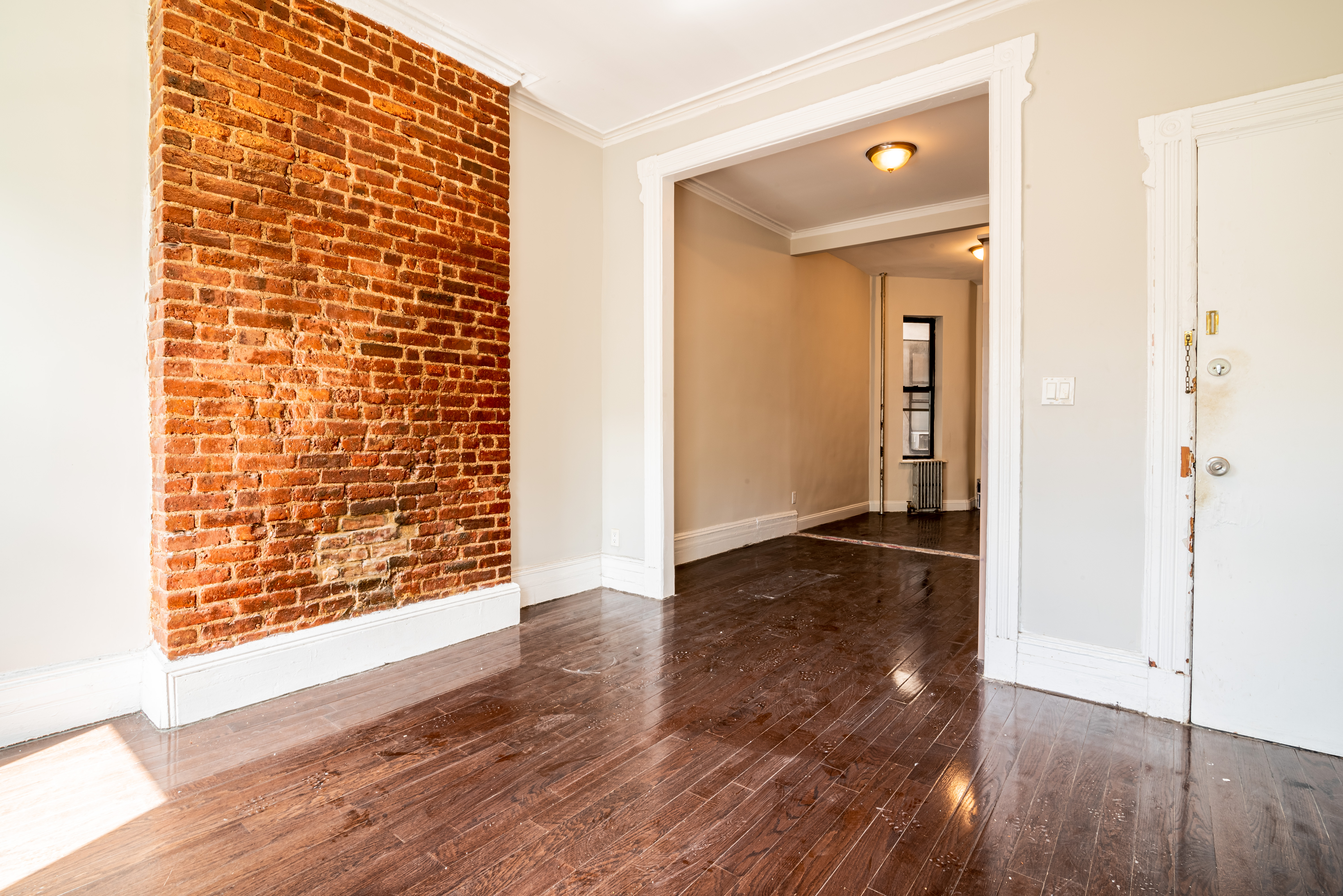 681 Sterling Place, Unit 2L Brooklyn, NY 11216 - Photo 4 of 8 wooden floor in an empty room with a gallery