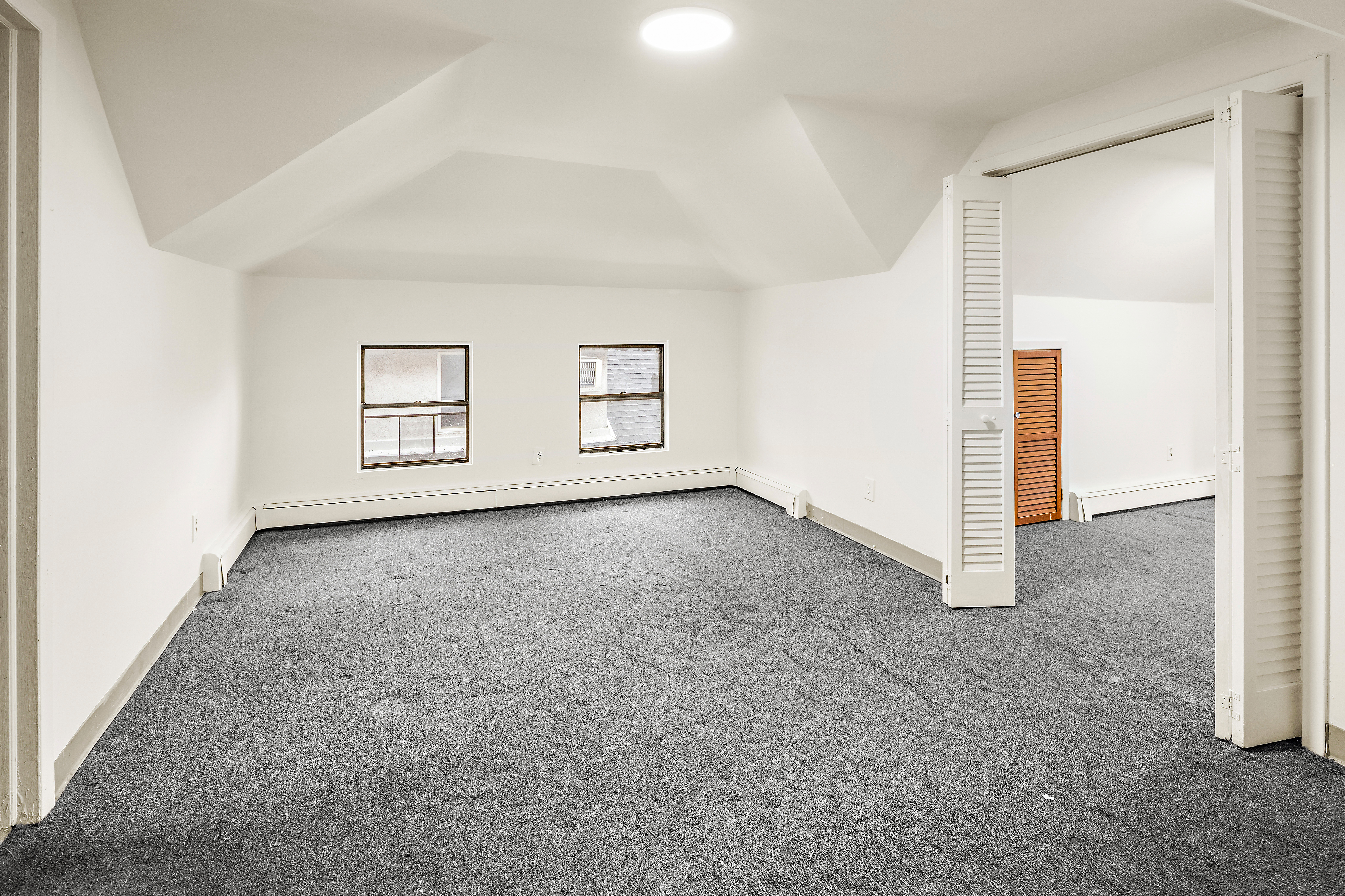 562 84th Street Brooklyn, NY 11209 - Photo 17 of 25 an empty room with windows