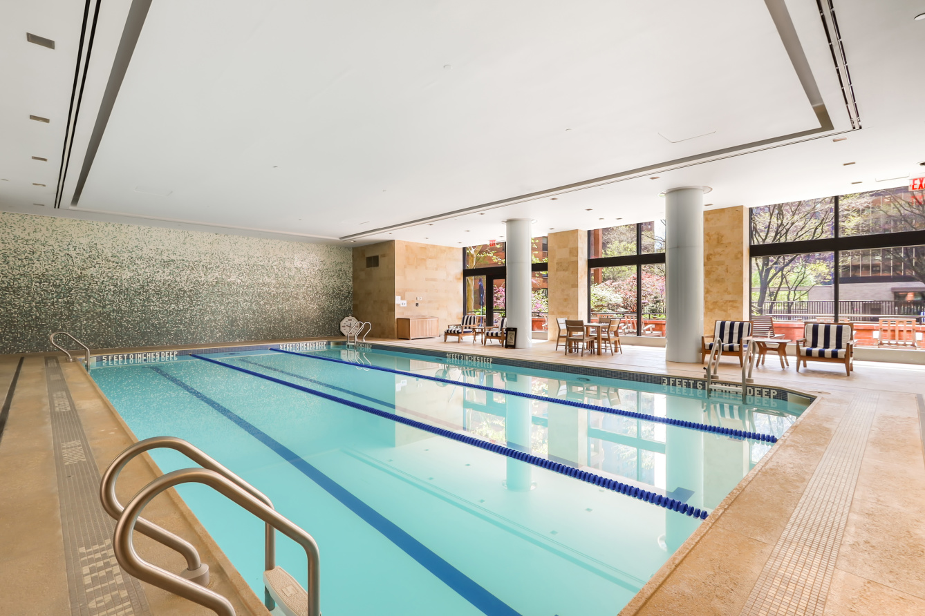 200 East 94th Street, Unit 2015 Manhattan, NY 10128 - Photo 10 of 16 a view of a swimming pool with outdoor seating