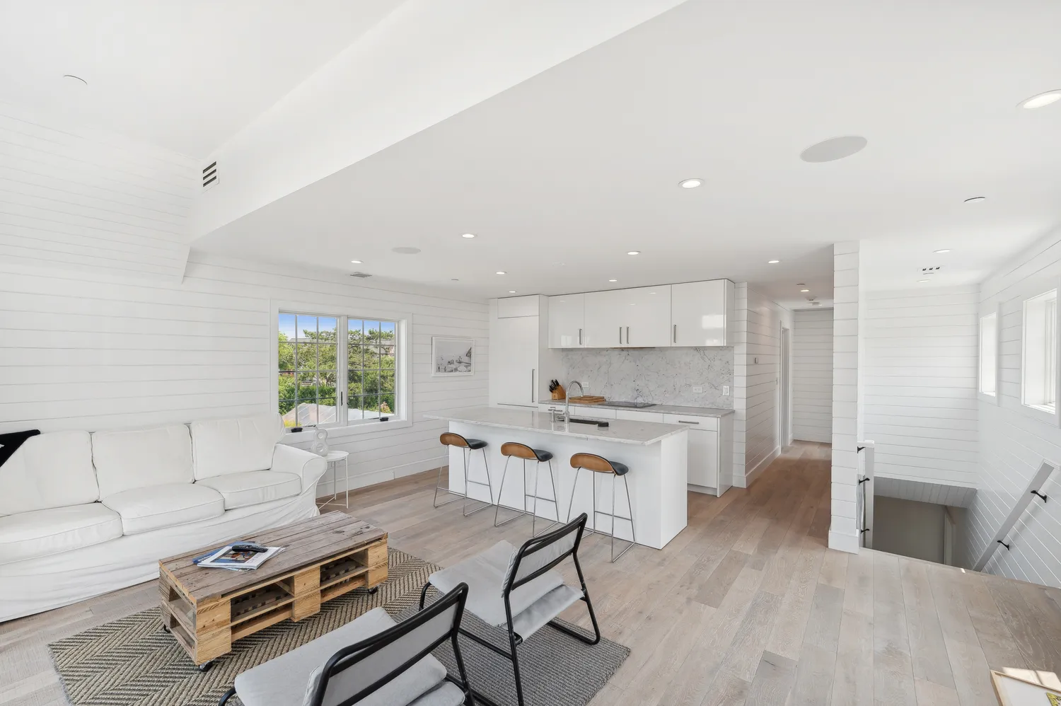 a living room with a couch and a window