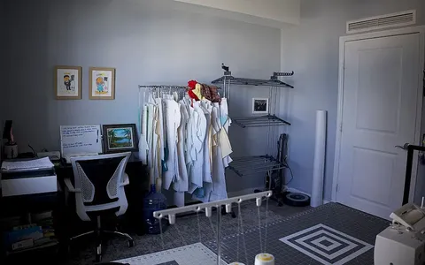 a view of workspace with furniture and a window