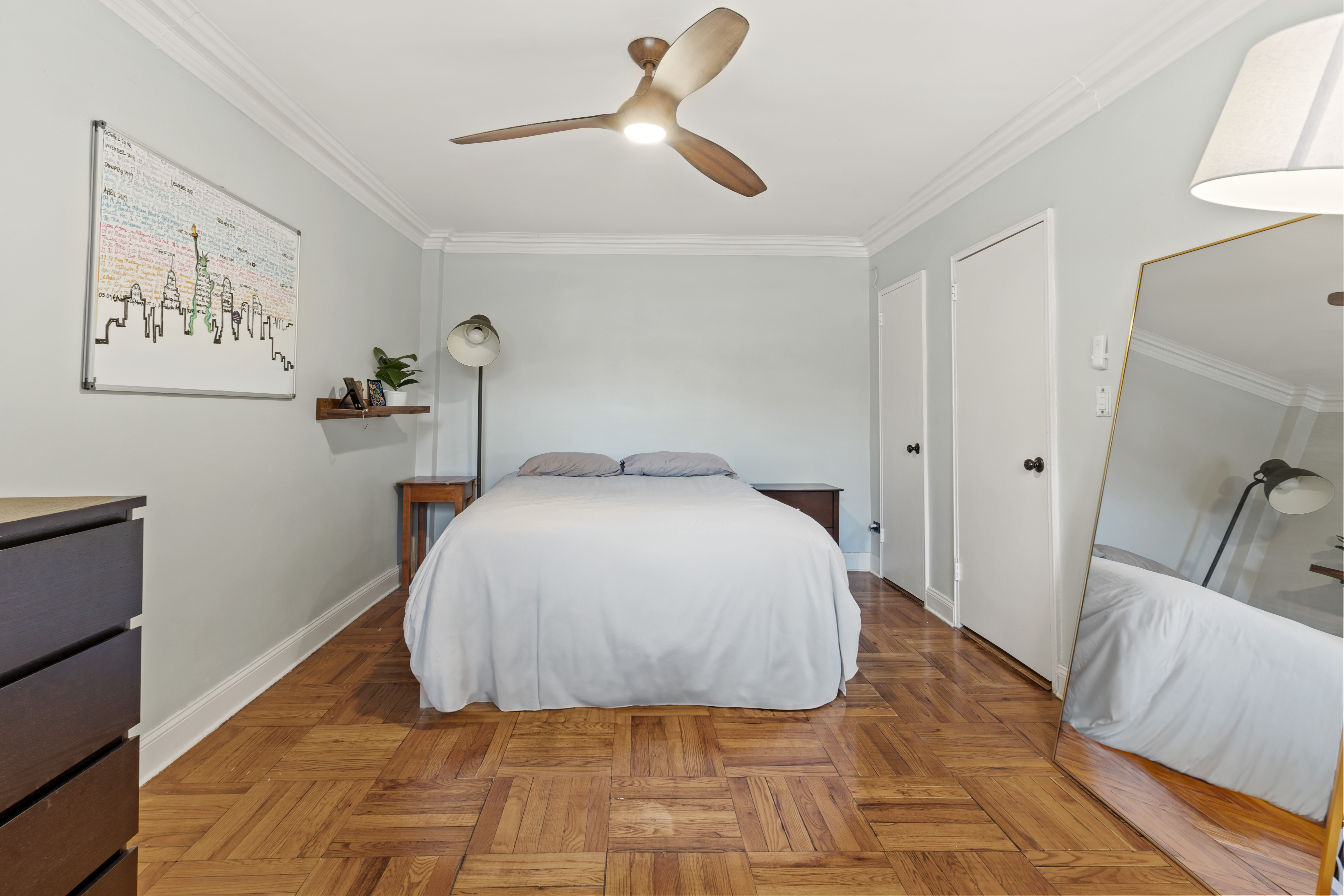 48-21 40th Street, Unit 1B Queens, NY 11104 - Photo 5 of 9 a bedroom with a bed and a rug