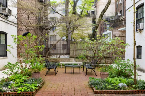 a building outdoor space with couple of sitting space