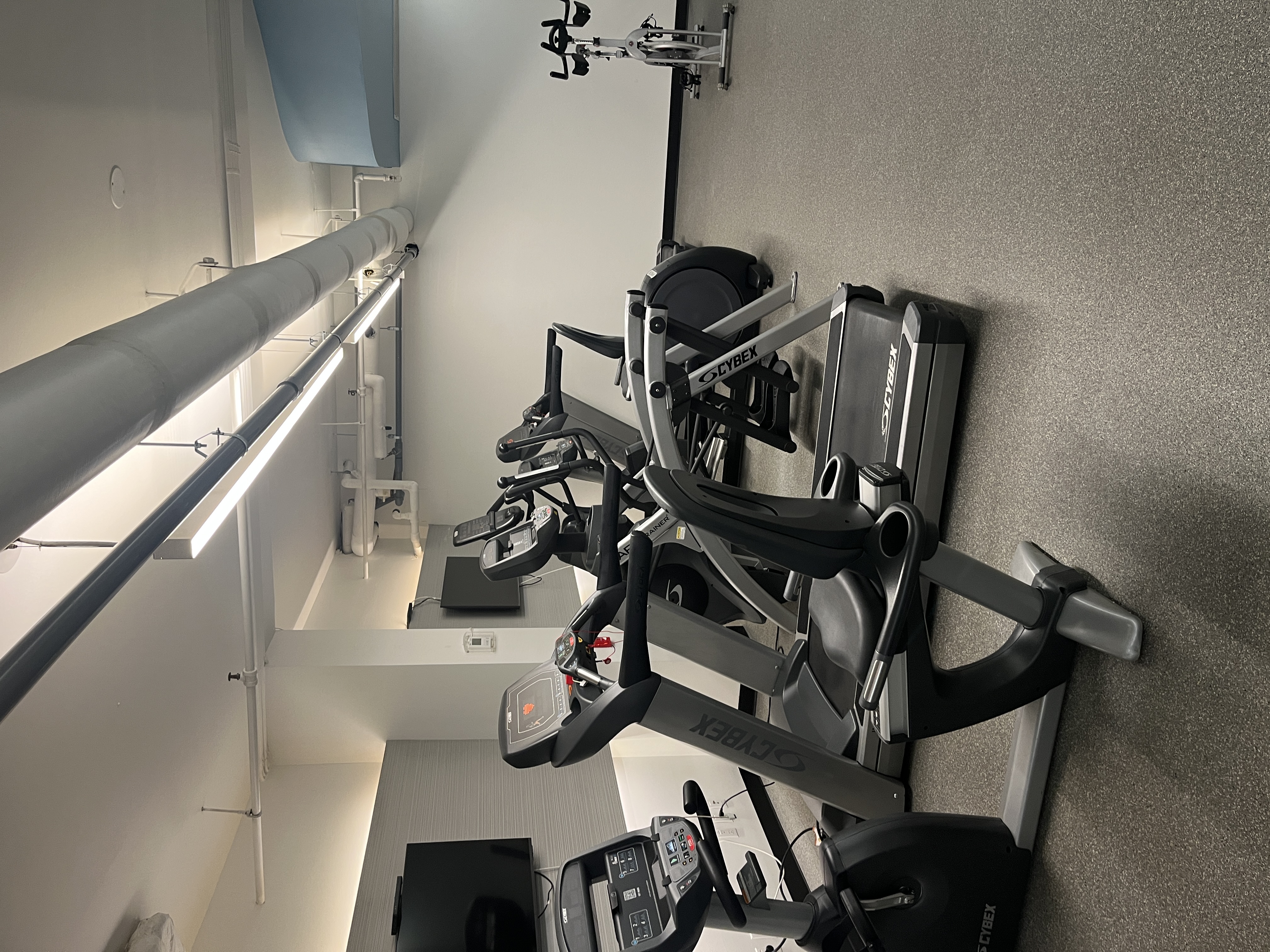 400 East 85th Street, Unit 15A Manhattan, NY 10028 - Photo 9 of 11 a room with gym equipment and a flat screen tv