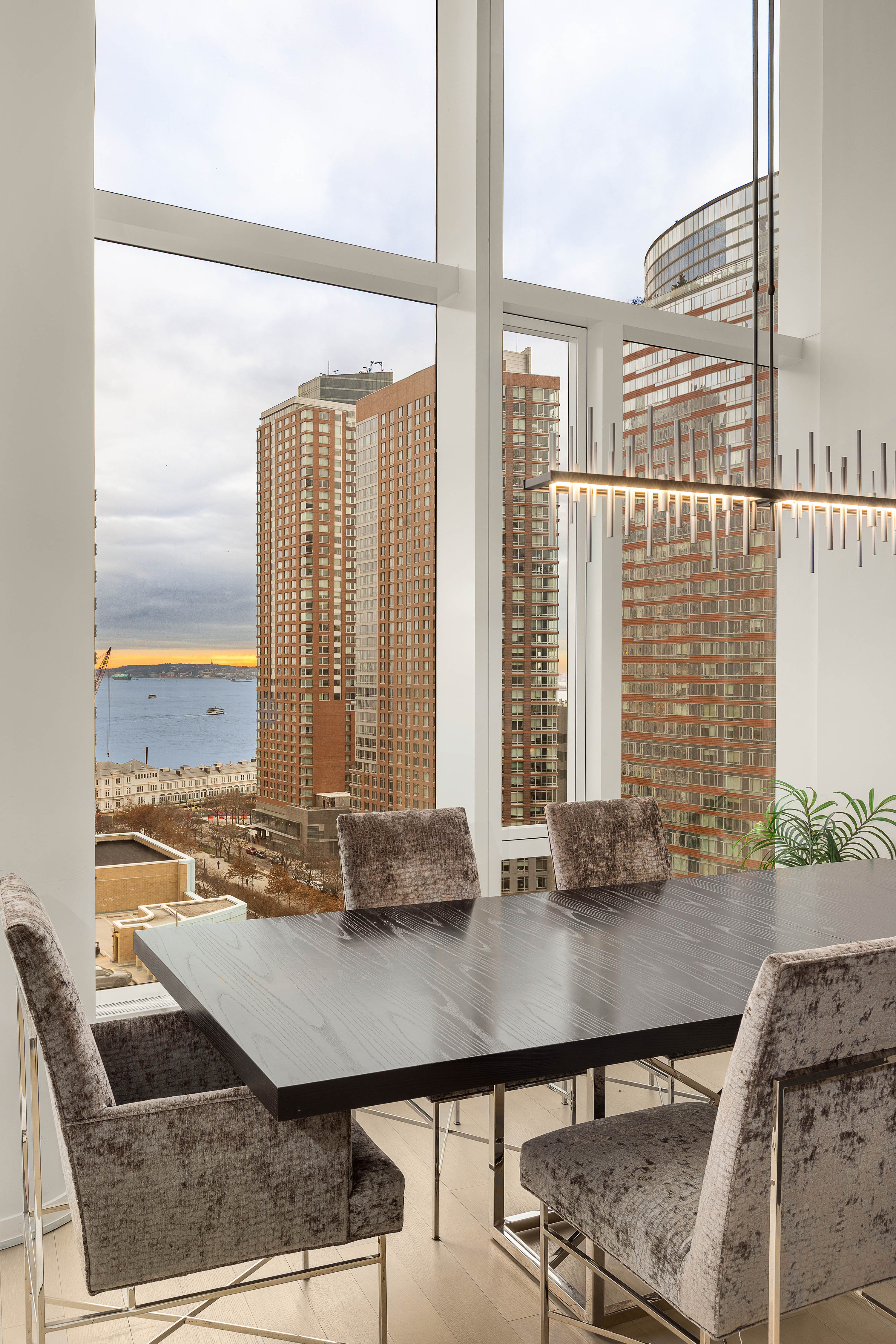 50 West Street, Unit 14B Manhattan, NY 10006 - Photo 6 of 29 a view of dining room with furniture