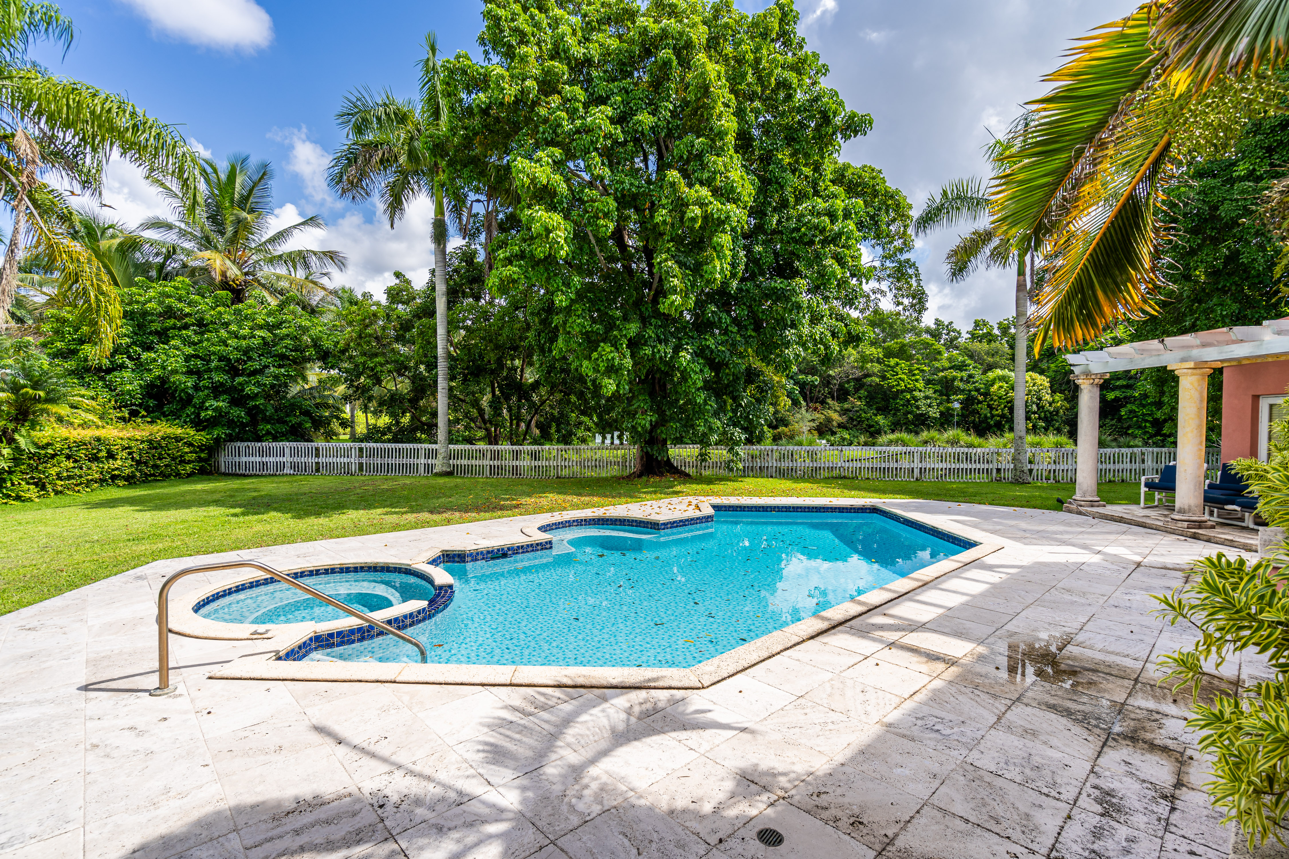 8768 Southwest 62nd Court Miami, FL 33156 - Photo 53 of 56 a view of a swimming pool and a yard