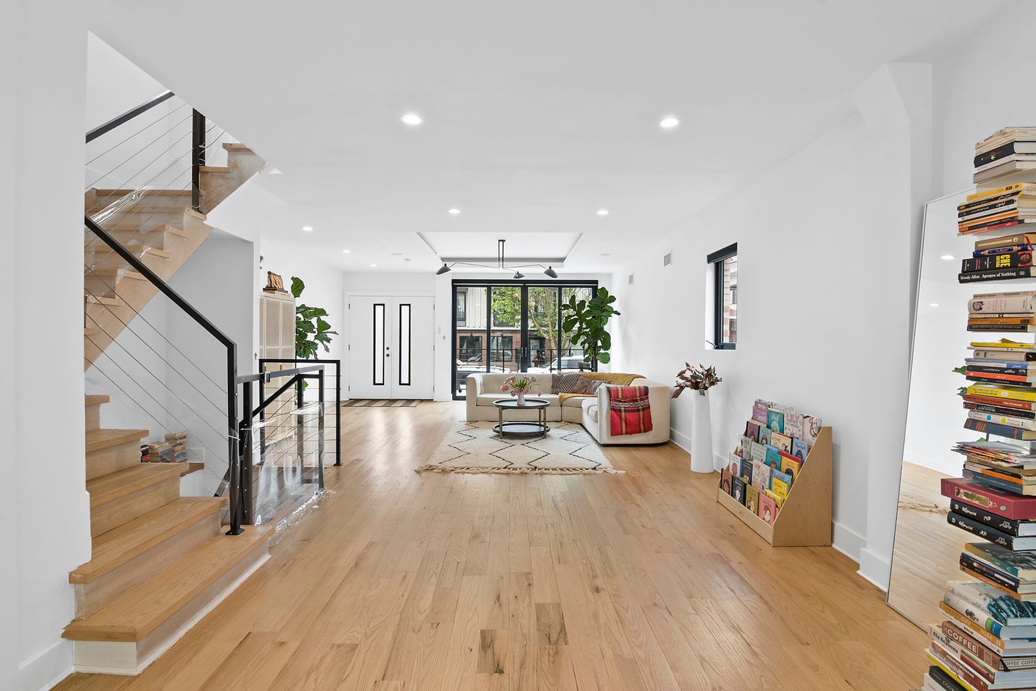 296 Fenimore Street Brooklyn, NY 11225 - Photo 4 of 19 a living room with furniture and a wooden floor