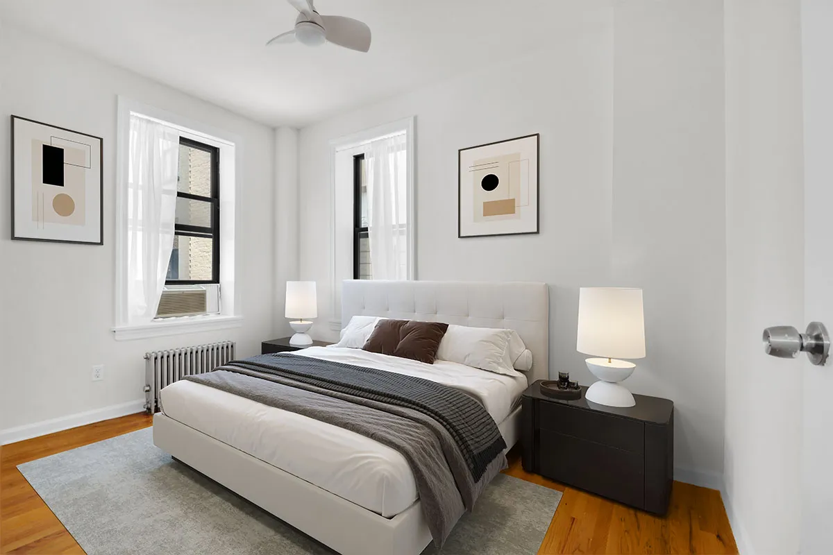 a bedroom with a bed and window