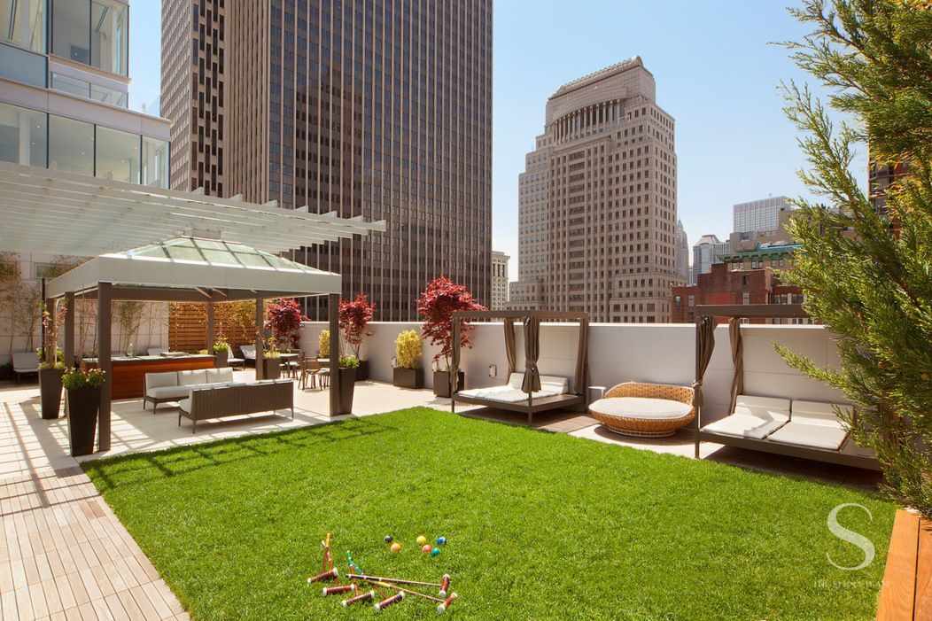 93 Worth Street, Unit 302 Manhattan, NY 10013 - Photo 7 of 10 a view of a patio with table and chairs and a barbeque