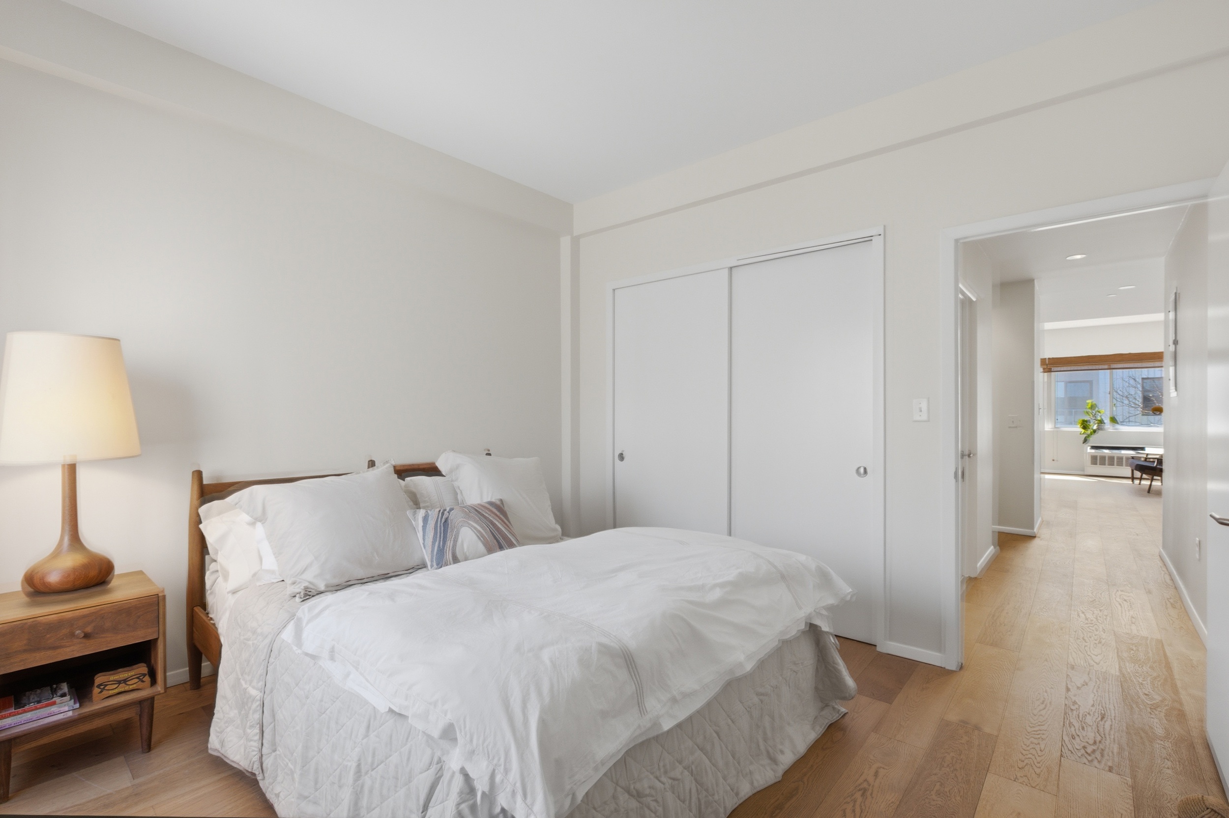 433 Warren Street, Unit 2C Brooklyn, NY 11217 - Photo 6 of 19 a bedroom with a bed and a lamp