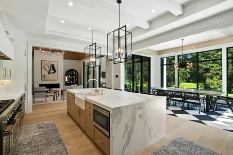 a kitchen with a stove a sink and a refrigerator