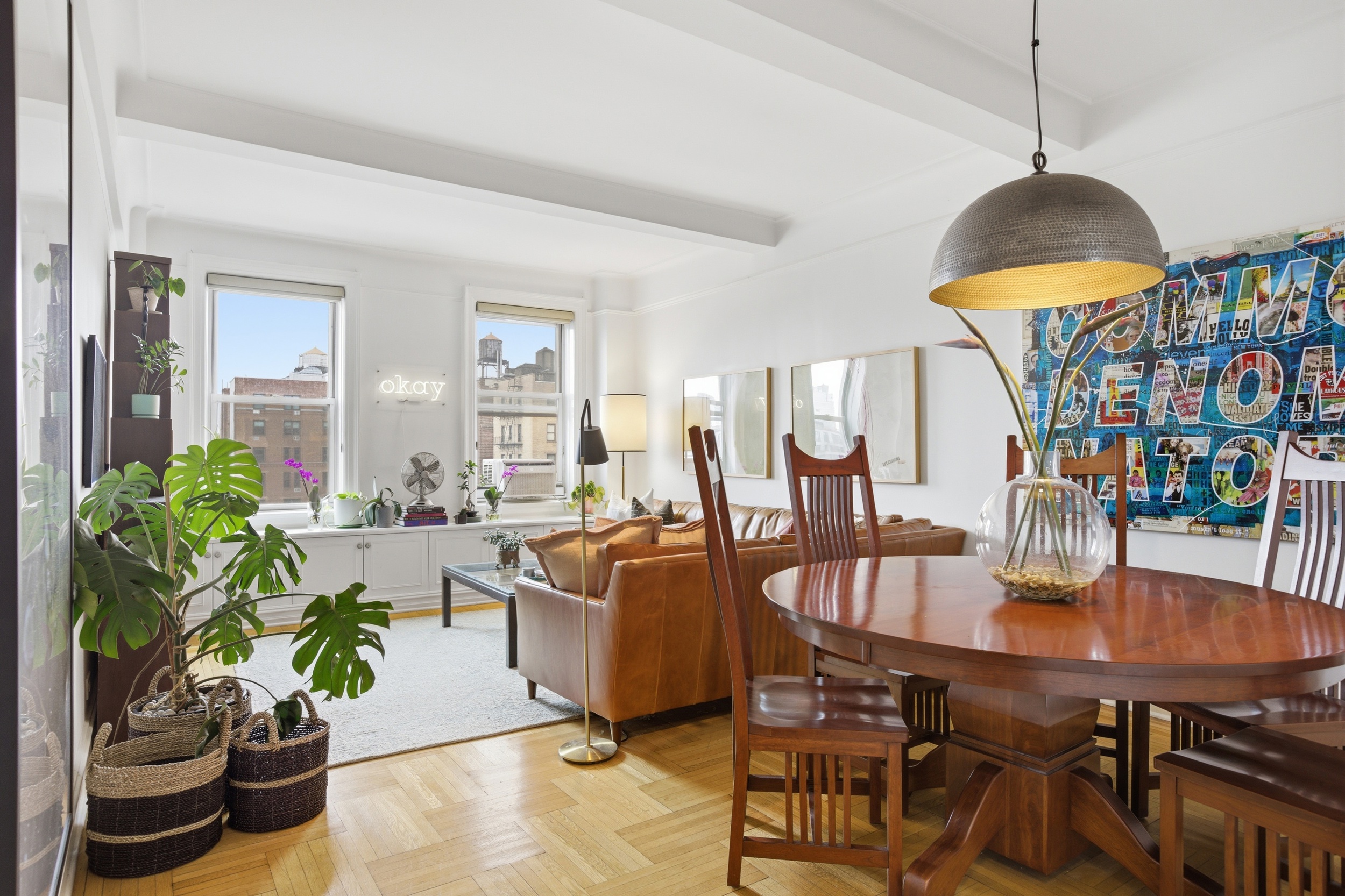 245 West 104th Street, Unit 14C Manhattan, NY 10025 - Photo 1 of 13 a living room with furniture and a potted plant