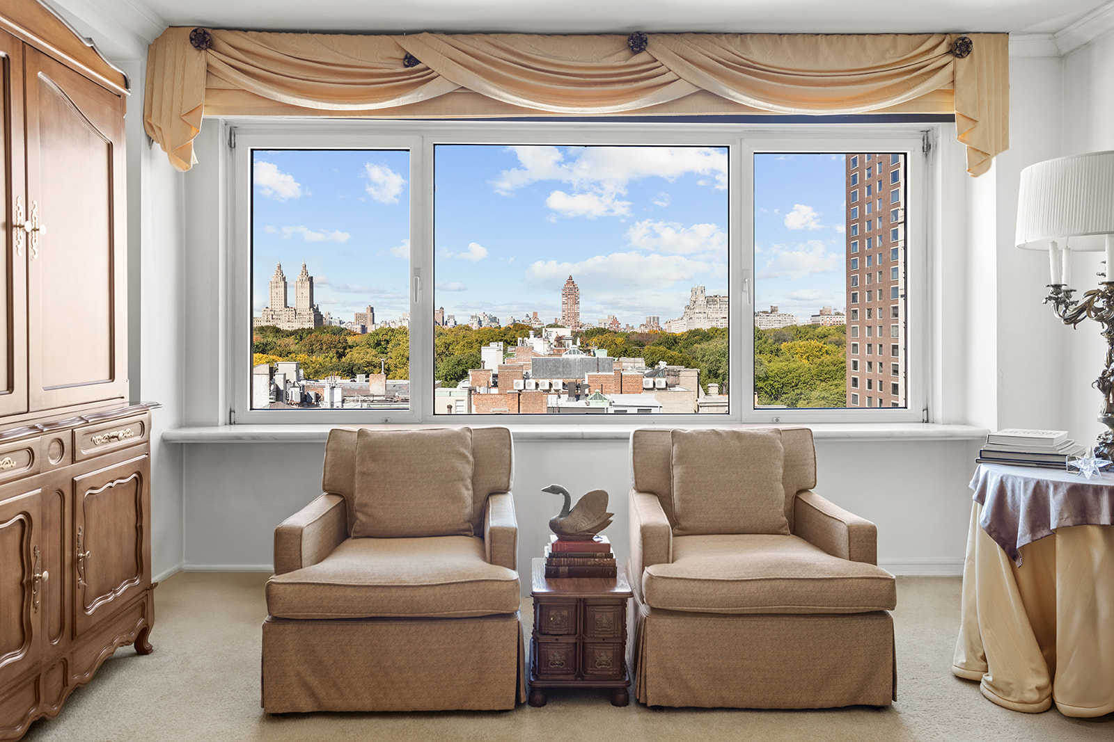 50 East 79th Street, Unit 12B Manhattan, NY 10075 - Photo 2 of 13 a living room with furniture and a window